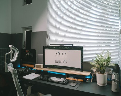 Ergonomic home office setup near a bright window